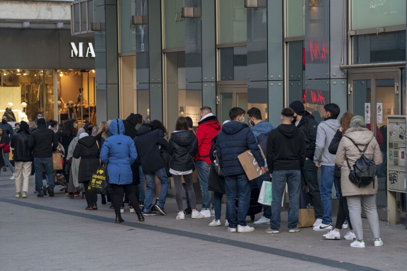 Shopping street Limbecker Strasse, long queues in front of some shops, here a fashion chain, pedestrian zone, full, many people shopping, some with many bags