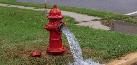 Open in industrial fire hydrant being sprayed strong water