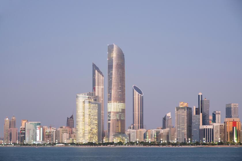 Skyline of modern buildings along Corniche waterfront in Abu Dhabi United Arab Emirates