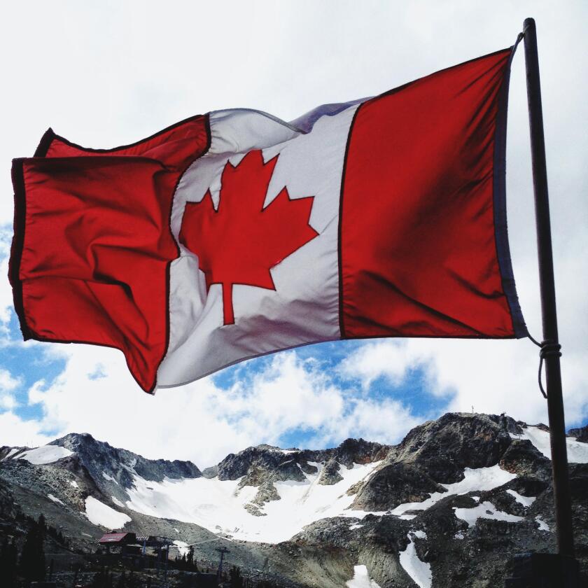 Canada, Whister, Flag of Canada waving over mountains
