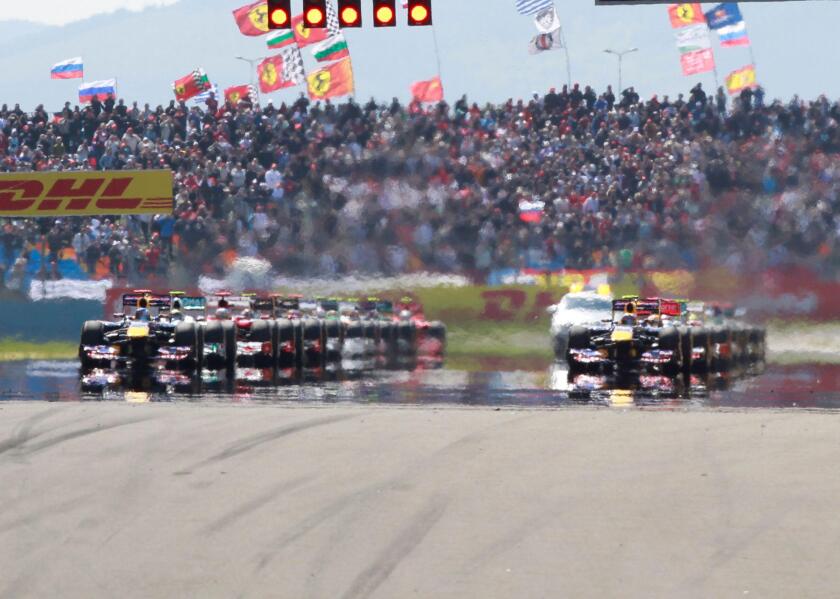 Formula One drivers line-up on the grid for the start of the Turkish F1 Grand Prix at the Istanbul Park circuit in Istanbul May 8, 2011.    REUTERS/Murad Sezer (TURKEY  - Tags: SPORT MOTOR RACING)